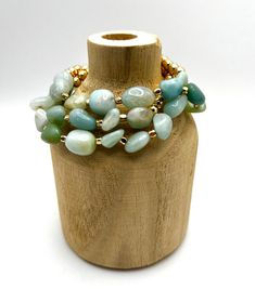 Our 'Cameron Bracelet Set' has a combination of natural shaped amazonite beads in different variations and textures contrasted with gold colored beads, making this bracelet set a stand out. It would pair well with most any outfit, and would make the sweetest gift, too! Natural shaped beads accented with gold colored beads Bracelet Set includes 3 separate bracelets Stretch Bracelets fit most Beads Making, Vintage Soul, Sweet Gifts, A Stand, Beads Bracelet, Natural Shapes, Stretch Bracelets, Jewelry Ideas, Bracelet Set