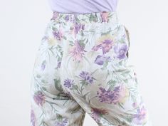 Item Description  This is a super cute and comfy pair of high rise lightweight poly rayon blend pants with the cutest pastel floral pattern! These have an elastic waist that stretches to fit a variety of waist sizes. These would be so good as both a lounge-pant, and more of an out and about type of pant! I love the versatility of this style and that fact that they could be so easily dressed up or down. These will be a go-to in your wardrobe for sure!! They are in good vintage condition and ready Vintage Floral Print Pants For Spring, Vintage Loungewear Pants For Spring, Vintage Spring Loungewear Pants, Spring Vintage Loungewear Pants, Floral Print Summer Pants For Daywear, Summer Floral Print Pants For Daywear, Casual Floral Print Pants For Daywear, Casual Floral Print Pants, Vintage Floral Print Bottoms For Spring