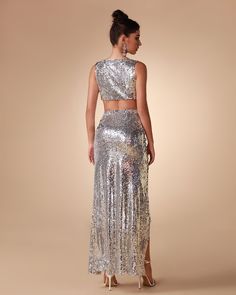 Unleash your inner diva with our Argent Sequin Two Piece Set. Featuring a glittery and glamorous sequin fabric, this two piece ensemble is perfect for making any night out extra special. Cut in a sleek silhouette, it's designed to flatter every figure and bring out your best look. Our Style No.KLYF823 Bead Piece Height - 68.9"/175cm Bust - 34.6"/88cm Waist - 25.6"/65cm Hips - 36.6"/93cm and wears size S About Wholesale/Dropshipping, please contact us! Note: Colour may vary due to lighting on ima Glamorous Sequin Fabric For Prom And Gala, Glamorous Sequin Fabric For Gala And Prom, Glamorous Fitted Embellished Sets, Glamorous Embellished Sequin Fabric For Prom, Glamorous Sequin Prom Dress For Festive Occasions, Glamorous Festive Sequin Dress For Night Out, Glamorous Sequin Fabric For Evening Prom, Glamorous Sequin Fabric For Prom And Festive Occasions, Glamorous Sequin Fabric For Gala And Prom Season