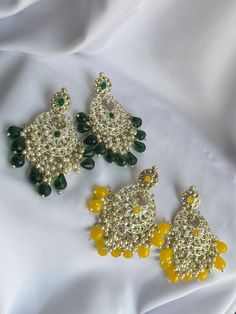 Features: - [HANDCRAFTED] These jhumka earrings are handcrafted with intricate detailing, making each piece unique. - [FOREST GREEN & LIME YELLOW] The vibrant colors of forest green and lime yellow make these earrings stand out. - [ETHNIC INDIAN JEWELRY] These jhumka earrings are a classic piece of ethnic Indian jewelry that can be worn for traditional occasions. Festive Green Drop Earrings Danglers, Green Drop Earrings Danglers For Festivals, Green Drop Earrings Jhumkas For Festivals, Green Drop Earrings For Festivals, Green Drop Jhumkas For Festivals, Traditional Green Beaded Earrings For Festivals, Green Festive Earrings For Festivals, Festive Green Earrings For Festivals, Green Round Earrings For Festive Occasion