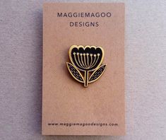 a brooch that is on top of a card