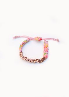 "Rose Gold Cluster Nugget Bracelets are handmade in New York City with Pink Bandana. Prasada in Sanskrit means \" God's blessing\". Nugget is a symbol of good fortune. Prasada bracelet is a nice gift with a great intention for yourself and your beloved. Meanwhile, it adds a romantic bohemian touch to your wrist to complete a casual chic look. The length of the bracelet is adjustable." Adjustable Colorful Beads Jewelry For Festivals, Traditional Jewelry With Sliding Knot For Festival, Adjustable Colorful Beaded Festival Jewelry, Adjustable Colorful Beaded Jewelry For Festivals, Pink Adjustable Spiritual Braided Bracelet, Pink Bohemian Braided Bracelet With Sliding Knot, Bohemian Pink Braided Bracelet With Sliding Knot, Adjustable Spiritual Bracelets For Festivals, Pink Resizable Bohemian Jewelry