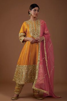 Buy Gold Anarkali And Salwar Dupion Silk Embellishment Gota Round Set For Women by Preeti S Kapoor Online at Aza Fashions. Long Dresses Indian Style Anarkali Suits, Festive Gold Designer Sharara, Gold Saree Dress With Mirror Work, Gold Dress With Mirror Work For Festive Occasions, Festive Gold Dress With Mirror Work, Unstitched Anarkali Set With Mirror Work For Festive Occasions, Festive Anarkali Sharara With Resham Embroidery, Bollywood Style Kurta With Mirror Work For Designer Wear, Gold Raw Silk Anarkali Set With Zari Work