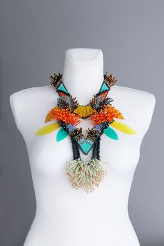 Colorful beaded necklace mood is tribal, bold, long, it is unique statement jewelry piece. Necklace collar is adjustable on the back with a lobster claw for each size of neck. The main colors of bib necklace are: orange, brown, teal, pale blue, pale green and yellow. All necklace made only of seed beads in bead embroidery technique. All my jewelry piece are unisex. It can be perfect gift for your self, for ones you love or great artwork gift for jewelry collectors and lovers. Made of: Seed bead, Statement Wedding Jewelry, Embroidery Collar, Colorful Beaded Necklace, Boho Statement Necklace, Theater Performance, Beading Inspiration, Brown Teal, Big Necklace, Necklace Collar