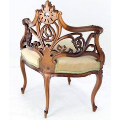 an ornate wooden chair with beige upholstered cushions