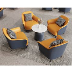 a group of chairs and couches sitting on top of a carpeted floor next to each other