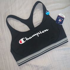 A Workout Wonder. Stay Supported During Your Fitness Routine With This Women's Champion Sports Bra. Black Racerback Activewear For Loungewear, Sporty Racerback Sports Bra For Loungewear, Black Athleisure Sports Bra For Loungewear, Sporty Black Sports Bra For Loungewear, Compressive Sweat-resistant Sports Bra For Training, Sporty Moisture-wicking Sports Bra, Sweat-resistant Nylon Sports Bra, Sweat-resistant Nylon Racerback Sports Bra, Black Medium Support Sports Bra, Sweat Resistant