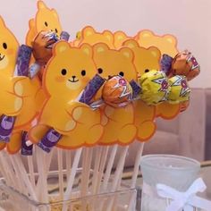 there are many candies in the shape of teddy bears on top of lollipop sticks