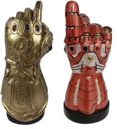 two gold and red hand - shaped objects are shown side by side