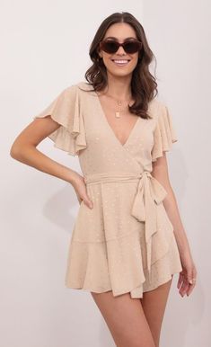 Party dresses > Eliza Wrap Dress in Tan Surplice Neckline Wrap Dress With Ruffles For Party, Surplice Neckline Ruffle Wrap Dress For Party, Party Wrap Dress With Ruffles And Surplice Neckline, Chic Party Wrap Dress With Ruffles, Fitted Wrap Dress With Ruffle Hem, Mini Length, Spring Wrap Dress With Ruffle Hem For Parties, Spring Party Wrap Dress With Ruffle Hem, Flirty V-neck Wrap Dress With Ruffles, Summer Wrap Dress With Ruffles For Party