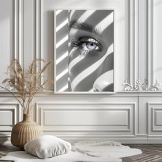 a white room with a vase filled with flowers and an eye looking through the blinds