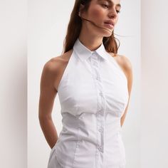 This Top Features A Non-Stretchy Material. It Has A Halterneck Design And A Classic Collar. The Top Has A Button Closure Down The Front And An Open Back. 100% Cotton Nwt Sleeveless Fitted Halter Top For Summer, Fitted Casual Sleeveless Halter Blouse, Fitted White Tank Halter Top, White Fitted Tank Halter Top, Fitted Casual Sleeveless Halter Top, Fitted Cami Halter Top For Day Out, Fitted Sleeveless Blouse Tank Top For Day Out, White Sleeveless Halter Top With Built-in Bra, Casual Fitted Sleeveless Halter Top