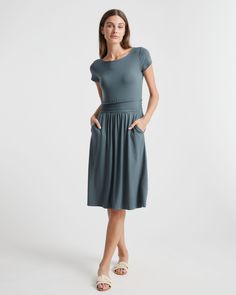 Fitted where you want it, flowy where it feels good. Our Tencel Jersey Ruched Waist Dress is the one-and-done outfit you’ll go to season after season. Eco-cool and all-day comfy, it’s as soft as it is sustainable, and it’s part of our growing knit-dress collection. With hidden side pockets for extra functionality, you’ll definitely say yes to this dress.  | Quince | Women's Tencel Jersey Ruched Waist Dress in Dark Olive, Size Small Ruched Waist Dress, Light Dress, Travel Dress, Capped Sleeve Dress, Versatile Dresses, Say Yes, Dress C, Waist Dress, Quince