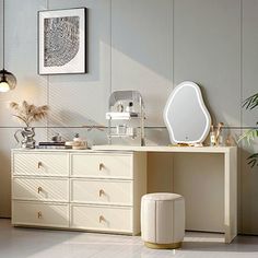 a white dresser sitting next to a mirror and potted plant