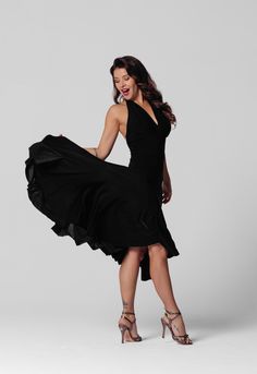 Make a statement on the dance floor with this elegant black tango dance dress. Designed with a halter neck and an open back, this dress brings a sense of allure to your dance routine. The top features a double-layered design, giving you the option to insert cups for added comfort and support. Its unique flared hem with panels adds a dynamic touch, moving gracefully with every step. The high-quality, stretchy fabric ensures ease of movement while the asymmetric hemline enhances the dramatic flair of your performance. This dress is the epitome of sophistication, perfect for passionate tango performances or elegant social dance events. Elevate your dance wardrobe with this exquisite piece. INDIVIDUAL TAILORING (DISCUSSED BEFORE ORDERING) You can order individual tailoring from us. We will be Tango Dance Dress, Social Dance, Dance Event, Tango Dance, Womens Sports, Dance Routines, On The Dance Floor, Layered Design, Dance Dress