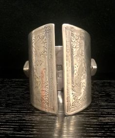 Early 19th Century Bedouin Silver Cuff, Hallmarked IB Bedouin cuff bracelet  This kind of heavy bracelet is worn by the Bedouin tribes of North Africa and the Arabian Peninsula. This is a very rare example of the work of John Bettridge, an early 19th-century silversmith from Birmingham.  John Bettridge was a highly prized silversmith who specialised mainly in small silver boxes and vinaigrettes. His marks are seen for 1817 - 1834 and he was a maker of caddy spoons, decanter labels, flatware and Traditional Engraved Wide Band Jewelry, Traditional Wide Band Engraved Jewelry, Antique Etched Cuff Bracelet, Antique Etched Adjustable Cuff Bracelet, Antique Etched Bangle Cuff Bracelet, Traditional Stamped Cuff Bangle, Traditional Etched Cuff Jewelry, Traditional Etched Cuff Bracelet, Bohemian Engraved Cuff Bracelet