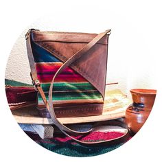 This crossbody bag is a beautifully hand crafted piece made in Bolivia. It's perfect for any adventure, day or night. Purse contains one compartment, as well as an inside zipper pocket, and closes with a zipper at the top. Strap is adjustable. The whole piece is made with authentic leather, with stamped details, and features a beautiful woven pattern on the front. Approximate Measurements:  10 inches tall x 10 inches wide x 4 inches deep at base Strap drop length is approximately 25 inches at longest. (Can be adjusted to shorten.) Artisan Crossbody Satchel With Leather Lining, Artisan Crossbody Shoulder Bag With Leather Lining, Artisan Travel Shoulder Bag With Leather Lining, Artisan Shoulder Bag With Leather Lining For Travel, Artisan Shoulder Bag For Travel With Leather Lining, Artisan Shoulder Bag For Everyday Use, Large Purse, Woven Pattern, Leather Weaving