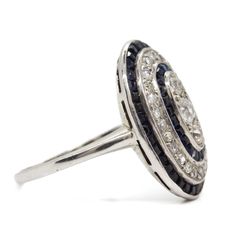 The Clara ring is an authentic vintage ring handmade during the Art Deco Era Circa 1920. It centers 3 old mine cut diamonds of I color and SI2 clarity that weigh 0.40ctw. This ring features 24 single cut diamonds of H color and SI2 clarity that weigh 0.40ctw and 36 natural calibrated cut sapphires that weigh 0.90ctw. This ring is currently size 7 ½ and can be sized.Ring measurement: 19mm by 14mmTotal weight: 2.6 dwt/ 4.1 grams Art Deco Jewelry Rings, Diamond And Sapphire Ring, Doing The Right Thing, Art Deco Era, Art Deco Jewelry, Contemporary Jewelry, Vintage Ring, Ring Handmade, Vintage Art Deco