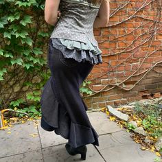 "This gorgeous skirt accentuates a woman's curves.  A dramatic skirt to wow, with great movement for dancing. Two tiered ruffle skirt with variegated hem line. Fit and flare style which is flattering on most body shapes.  Made from a pair of quality stretchy cotton corduroy dress pants.    Featuring 4 functional pockets, 2 on back side and 2 on the hips.  Soft to touch and navy blue with beige undertones.  Size Medium Waist 31\"-32.5\" Hip 39\"-42\" Length:  Front: 20\" Back: 35\" This is a zero Gothic Ruffled Stretch Bottoms, Gothic Stretch Ruffle Bottoms, Gothic Stretch Bottoms With Ruffles, Fitted Skirt With Ruffle Hem, Fitted Vintage Bottoms With Ruffles, Gothic Fitted Bottoms With Ruffled Skirt, Vintage Fitted Ruffled Skirt Bottoms, Fitted Vintage Ruffled Skirt Bottoms, Fitted Tiered Skirt With Ruffles