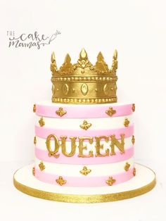 the cake is decorated with pink and gold frosting, which reads'queen '