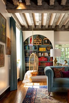 a living room filled with furniture and bookshelves