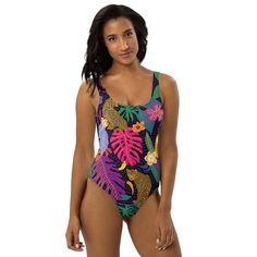 ABOUT Be beach ready in our In the Tropics One-Piece Swimsuit! The smooth fabric and flattering design hug your body, while the cheeky fit and scoop neckline make a statement. Whether by sea or pool, this swimsuit will make you feel invincible. Crafted out of 82% Polyester and 18% Spandex, this chlorine-resistant fabric features zig-zag stitching, double-layer front, and four-way stretch material for maximum comfort and mobility. Dare to be bold! DETAILS Chlorine-resistant fabric Cheeky fit with Beach Ready, Hug You, Be Bold, Zig Zag, Scoop Neckline, Make You Feel, Double Layer, One Piece Swimsuit, Stitching