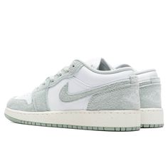 The Air Jordan 1 Low is a signature footwear style and is constructed with a premium leather upper, the silhouette is met with classic Nike motifs including the Swoosh stitched upon the side panels and branding embroidered on the heel. A pull-tab contributes to its easy application while Nike's Air technology is added within the midsole for a responsive experience with each step. Leather and synthetic upper Cotton lace closure Air-Sole unit Rubber outsole Stitched motifs Embroidered branding Grade school sizing Style no: FN9137-131 Jordan 100, Air Jordan 1 Low, Jordan 1 Low, Kids Jordans, Grade School, Side Panels, Pull Tab, Air Jordan 1, Cotton Lace