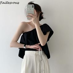 Brand Name: FaitesvousStyle: Office LadyOrigin: Mainland ChinaCN: GuangdongFabric Type: ChiffonMaterial: PolyesterThickness: LightweightClothing Length: ShortDecoration: RUFFLESShirts Type: Casual ShirtsDress Patterns: PulloverFabric content: 31% (inclusive) - 50% (inclusive)Collar: Skew CollarSleeve Style: RegularSeason: Spring/AutumnModel Number: 2114530Material Composition: Synthetic fiberPattern Type: SolidSleeve Length(cm): SleevelessCombination Form: Single-piece SetGender: WOMENAge: Ages Spring Black Off-shoulder Tank Top, Black Off-shoulder Tank Top For Spring, Sleeveless Crop Tops, White Shirts Women, Summer Black, Shirts Women, Sleeveless Crop Top, White Shirts, Single Piece