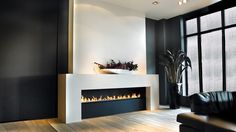 a modern fireplace in the middle of a living room