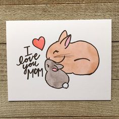 i love you mom card with an image of a bunny hugging a mouse on it