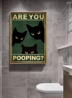 a bathroom with a toilet and a poster on the wall that says are you pooping?