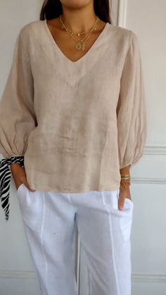 Brown Cotton V-neck Blouse, Beige Cotton V-neck Blouse, Beige V-neck Blouse Solid Color, Beige V-neck Solid Color Blouse, Beige V-neck Solid Blouse, Beige Solid Color V-neck Top, Long Sleeve Neutral Tops For Vacation, Neutral Long Sleeve Tops For Vacation, Cream Linen V-neck Top