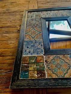 a mirror that is on the side of a wooden wall next to a window and floor