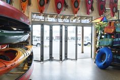 there are many kayaks on display in the store