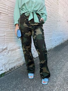 camo is the new gray!! it matches anything!! these cargo pants are made with a straight leg fit:: street wear made easy! shop more casual pants! sizing, details & care model sizingLivi is 5'4" 140lbs with a 32" bust and 28" waist wearing a mediumDee is 5'5" 135lbs wearing a medium details - 95% cotton, 5% spandex care- machine wash cold- do not bleach- line dry- low iron if needed Fall Combat Cargo Jeans For Streetwear, Urban Khaki Cargo Jeans For Fall, Fall Combat Wide Leg Cargo Pants, Combat Pants With Cargo Pockets For Fall, Full Length Khaki Cargo Jeans For Fall, Military Style Straight Leg Parachute Pants For Streetwear, Green Baggy Combat Bottoms, Camouflage Wide Leg Cargo Bottoms, Khaki Cargo Style Bottoms For Fall