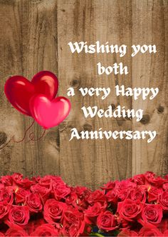 red roses and two heart balloons are in front of a wooden background with the words wishing you both a very happy wedding anniversary