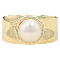 Size: 7 1/4 Sizing Fee: Up 2 sizes for $60 or Down 3 sizes for $50 Metal Content: 14k Yellow Gold Stone Information Cultured Pearl Size: 7.7mm Style: Solitaire Features: Slightly contoured shoulders Measurements Face Height (north to south): 13/32" (9.9mm) Rise Above Finger: 3/8" (9.3mm) Weight: 7.5 Grams Stamps: 14k, maker's mark (worn, partial) Condition: Pre-Owned Professionally cleaned, polished, and tested to guarantee metal content. Silver And Gold Ring, Yellow Gold Solitaire Ring, Pearl Rings, Yellow Gold Solitaire, Gold Solitaire Ring, La Face, Gold Stone, Pearl Size, Pearl Ring