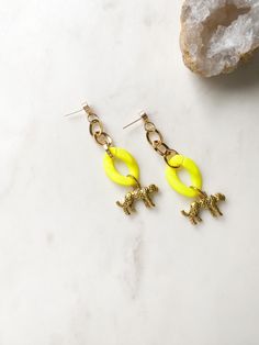 ABOUT THIS PIECE:  Limited edition handcrafted cougar/panther earrings. Great for everyday wear, vacationing or for a special occasion. Approximately 2.25" long.  Gold hardware is stainless steel base and coated in vermeil.  I also sell other neon yellow jewellery as shown in one of the pictures, that match well with these earrings.  NOTE: We use standard shipping to mail our orders, this service does not come with a tracking number. If you would like a tracking number or would like your order s Panther Earrings, Leopard Earrings, Yellow Jewelry, Yellow Earrings, Blue Beach, Earrings Statement, Free Gift Wrapping, Neon Yellow, Chandelier Earrings