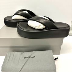 Brand New Balenciaga Rise Thong Platform Sandal. Retails At $625.00 Tax. *Includes Box And Dust Bag -Size 40 (10us) -Smooth Nappa Lambskin -Thong Sandal -Rounded Toe -60mm Platform -Balenciaga Logo Printed On The Back Of Sole -Tone-On-Tone Sole -Black Insole -Made In Italy Shoes Balenciaga, Balenciaga Logo, Balenciaga Shoes, Thong Sandals, Platform Sandals, Women's Shoes Sandals, Balenciaga, Shoes Sandals, Dust Bag