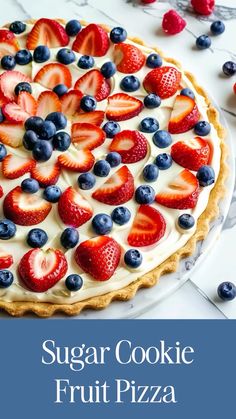 a close up of a pie with strawberries and blueberries on the top, text reads sugar cookie fruit pizza