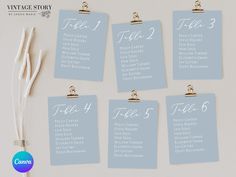 a table plan with blue paper pinned to it's sides and white writing on them