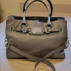 *Rare Find* Michael Kors Tote/Shoulder Bag 100% Authentic: Like New-Nwot Color: Grey Material: Soft Pebbles Leather Silver Tone Hardware Strap: Double Handle / Longer Chain Strap 2 Main Compartment Plus Zip Full Length Pocket Interior Zip Pocket/2 Open Pockets Fabric Lining Very Light Scratches On Face Plate And Feet Measurements: 14” L X 13” H X 5” D As As-No Returns Classic Satchel With Silver-tone Hardware For Errands, Classic Michael Kors Satchel With Handles, Designer Travel Satchel With Silver-tone Hardware, Michael Kors Designer Satchel With Double Handle, Michael Kors Designer Shoulder Bag With Silver-tone Hardware, Designer Michael Kors Satchel With Branded Hardware, Michael Kors Designer Double Handle Satchel, Designer Michael Kors Shoulder Bag With Silver-tone Hardware, Designer Michael Kors Satchel With Adjustable Strap