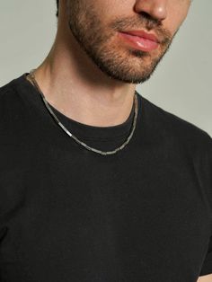 Upgrade his style with our Men's Bar Chain Necklace. This dainty, stainless steel piece is perfect as a choker or for layering. Simple yet elegant, it's an ideal gift for him, adding a touch of sophistication to any look. Modern Stainless Steel Chain Choker Necklace, Modern Stainless Steel Choker Chain Necklace, Modern Stainless Steel Chain Choker, Minimalist Stainless Steel Choker Chain Necklace, Modern Stainless Steel Necklace With Paperclip Chain, Modern Stainless Steel Figaro Chain Necklace, Modern Stainless Steel Snake Chain Necklace, Minimalist Stainless Steel Figaro Chain Jewelry, Minimalist Stainless Steel Jewelry With Figaro Chain