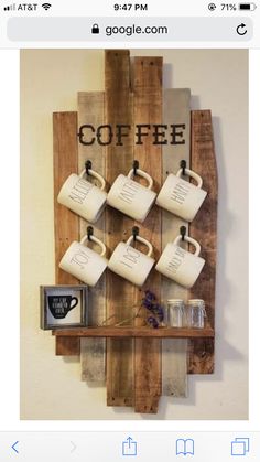 a wooden pallet with coffee mugs hanging on it