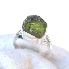 "Raw Peridot Ring, Split Band Ring, Green Peridot Ring, Sterling Silver Ring, Handmade Silver Ring, Rough Stone Ring, Raw Stone Ring, Thanks \"\"Gemstone Size depends on the Ring Size.\"\" Most of the Products are Made to Order. No two gemstone are similar and images cannot define exact product definitions. Sizes - Available in all Sizes US 1 - US 15 Shipping Policy - I mainly use USPS , DHLE Global Mail Asia, UPS, FedEx for the shipping of goods depending on the amount and days that you have or Untreated Green Promise Ring, Green Untreated Promise Ring, Rough Stone Ring, Raw Peridot, Herkimer Diamond Ring, Raw Stone Ring, Handmade Silver Ring, Natural Diamond Ring, Black Diamond Ring