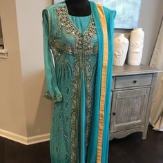 Hi, I Am Selling A New Pakistani Blue Handmade Silk Maxi Dress 4-Piece Suit For Womens In Size 8/10 Any Questions Please Ask. All Items Come From A Pet-Free And Smoke-Free Home. Measurements: Shoulder: 15 Inchesbust: 19 Inches Waist: 19 Inches Pants: Waist: 32 Length: 41 Inches Shirt Can Be Altered, There Is Fabric Inside Blue Festive Evening Sets, Festive Evening Blue Sets, Festive Blue Evening Sets, Fitted Blue Sets For Reception, Blue Fitted Sets For Reception, Elegant Turquoise Dress For Festive Occasions, Elegant Turquoise Festive Dress, Elegant Turquoise Festive Set, Elegant Fitted Full Length Salwar Kameez