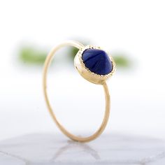 Striking lapis lazuli ring with a spike, unique gold ring, statement ring. The ring is 100% handcrafted in 14k gold. The stone is in bezel hammered setting In the back of the ring there is tiny heart cut out. This ring can be a wonderful Birthday or holiday gift for a Woman. CENTRAL STONE: *natural lapis lazuli *shape: round peaked stone *color: purple/blue *stone with setting: 7.4mm SPECIFICATIONS: *band: 1 mm, high polish *material: 14k yellow gold (this ring is also available in 14k rose or w Yellow Gold Lapis Lazuli Gemstone Rings, Yellow Gold Rings With Lapis Lazuli Gemstone, Lapis Lazuli Gemstone Rings Fine Jewelry, Fine Jewelry Lapis Lazuli Rings For Gifts, Fine Jewelry Lapis Lazuli Gemstone Rings, Gold Lapis Lazuli Gemstone Rings, Gold Rings With Lapis Lazuli Gemstone, Round Lapis Lazuli Cabochon Rings, Gold Lapis Lazuli Ring As Gift