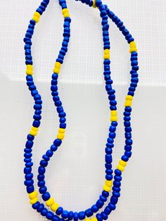 This is an Ochosi Orisha necklace. Has been designed, 100% handmade. With beautiful beads and accessories. Can be used with an everyday outfit, while wearing your Orishas Necklace. Please handle with care! Must be used delicately and to not use near harmful chemicals or liquids. Made from strong material Comes in one size only! Any questions or comments send me a message. No refund or exchange. Visit my store each week for new items, also visit my other stores on Etsy at MandSMagicJewelryBox for Large Oval Bead Necklace For Beach, Yellow Necklaces With Wooden Beads For The Beach, Unique Tiny Beads For Beach, Beach Beaded Necklace With Large Oval Beads, Yellow Beach Necklaces With Wooden Beads, Beach Necklace With Large Oval Beads, Oval Beach Necklace With Large Beads, Artisan Beaded Necklaces With Oval Beads For Beach, Heishi Beads Wooden Necklaces