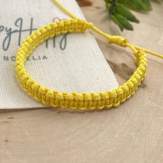 "Happy color macrame bracelet made of waxed cord. This waterproof adjustable bracelet has the perfect color to transmit energy, vibrant yellow! The color of the sun. This happy bracelet was designed for everyday wear. This minimalist boho yellow cord bracelet enhances your casual outfit.  ♥ ITEM DETAILS: Total length: The size of the bracelet is adjustable.  💕The bracelet has an adjustable closure that will work on a wrist of about 6 - 7\"💕 Materials: Waxed cord Waxed Cord Available: Yellow Waxed Cord Size: 1mm waxed cord ♥ GIFT IT Jewelry comes in a cute canvas bag ready to gift! If you wish your item to be a gift, please let me know and I will include a cute little card with a personal message. ♥ CURRENT PROCESSING TIMES: normally we ship orders out within 1-3 days  (the time I need to Handmade Trendy Yellow Friendship Bracelets, Adjustable Yellow Bracelets For Friendship, Adjustable Yellow Bracelet For Friendship, Yellow Bohemian Friendship Bracelets For Everyday, Handmade Yellow Friendship Bracelets, Yellow Bohemian Friendship Bracelets, Bohemian Yellow Friendship Bracelets, Yellow Friendship Bracelets For Beach, Yellow Braided Friendship Bracelets