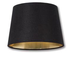 a black lamp shade with gold trim